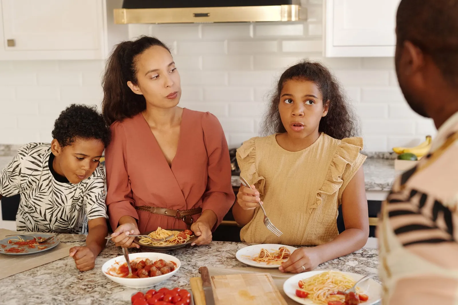 A family eating together at home, free of creditor calls