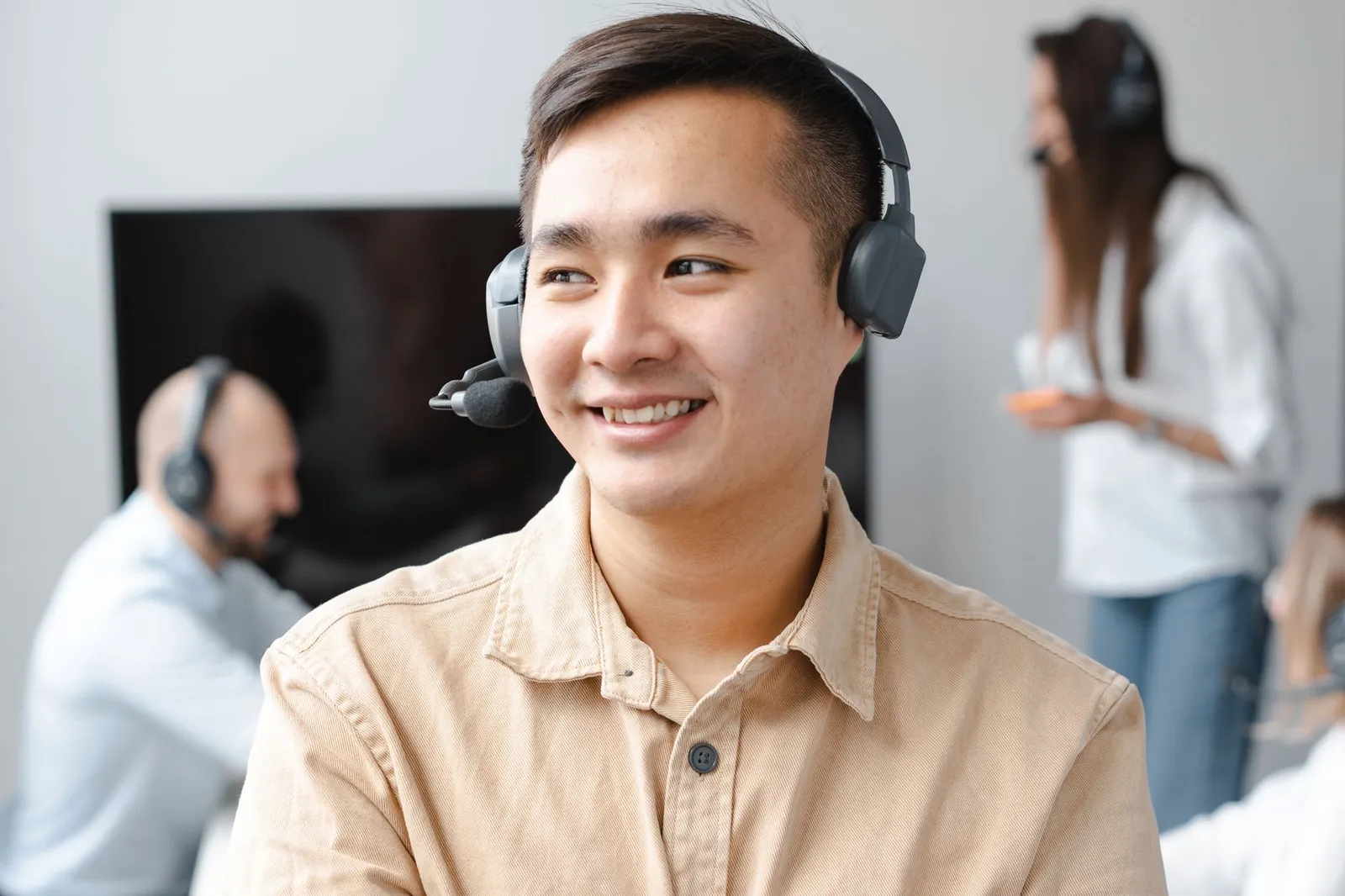 A Credit Gym specialist answering client questions on a call